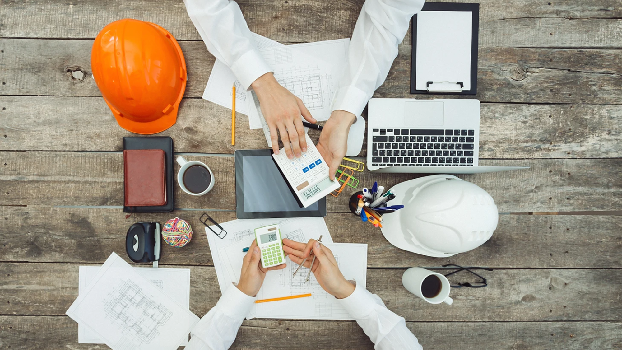 SEO strategies for construction industry concept with a digital marketing plan on a desk.