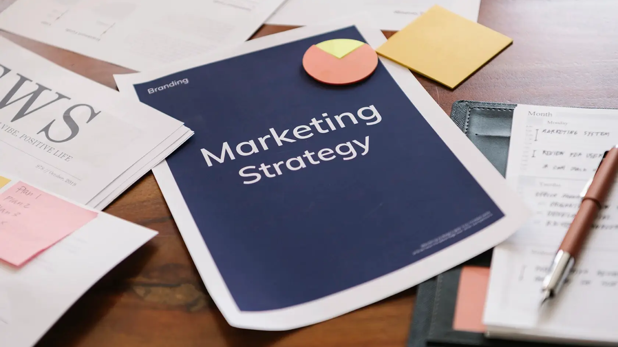 Building materials marketing strategy concept with a digital marketing plan on a desk.