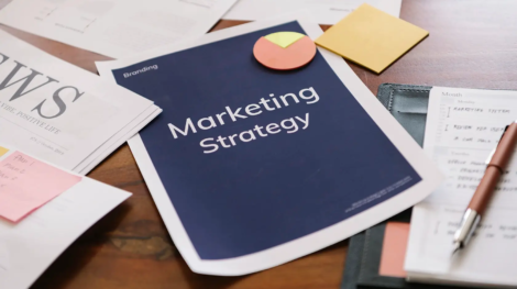 Building materials marketing strategy concept with a digital marketing plan on a desk.